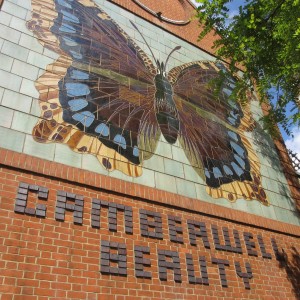 Mural with the words Cameberwell Beauty picked out in brick beneath